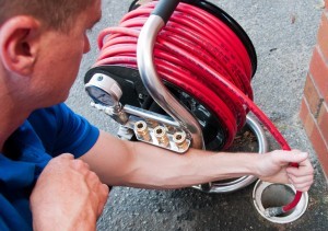 Jack is one of our Woodinville drain cleaning pros and he uses a drain snake to clear a clogged drain