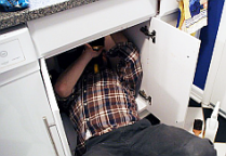 Matt is repairing a broken garbage disposal